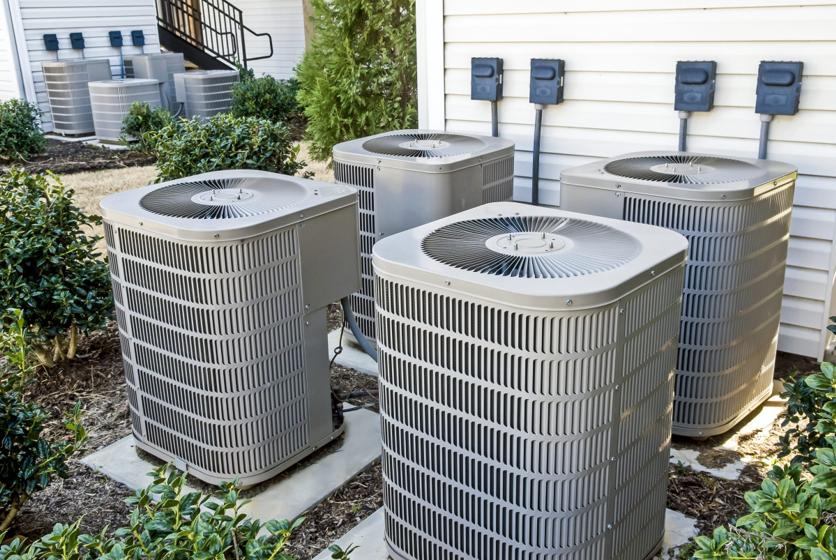 A bank of residential condensing units installed by Conditionaire